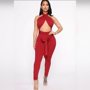 Red halter jumpsuit cut out with tie front skinny leg backless